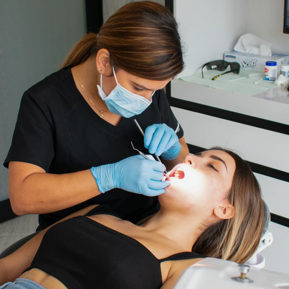 Patient showing confident new smile after restorative dentistry in Playa del Carmen