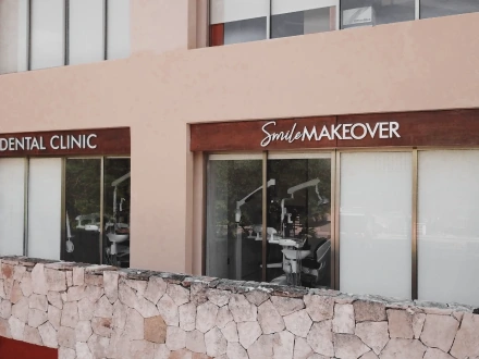 Modern and stylish reception area of Smile Makeover Playa del Carmen dental clinic, featuring luxury exterior design and professional branding.