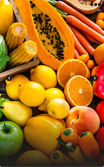 colored fruits and vegetables like papaya, lime, orange, carrots, peppers