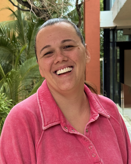 Patient displaying results of cosmetic dental work in Mexico, featuring a straighter and brighter smile.