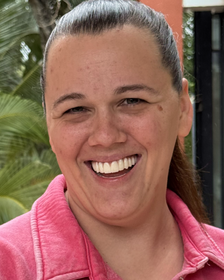Happy patient after full-mouth dental restoration and cosmetic dentistry treatment.