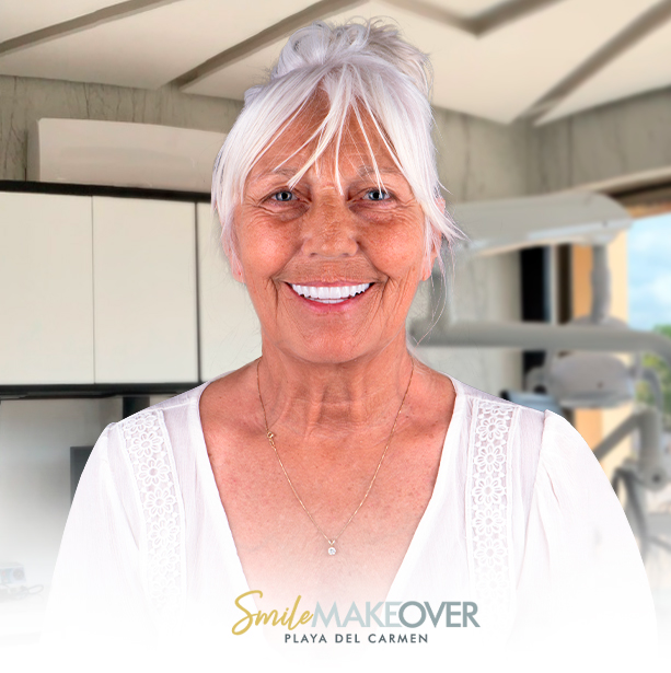 smiling elderly woman with white hair tied up casually